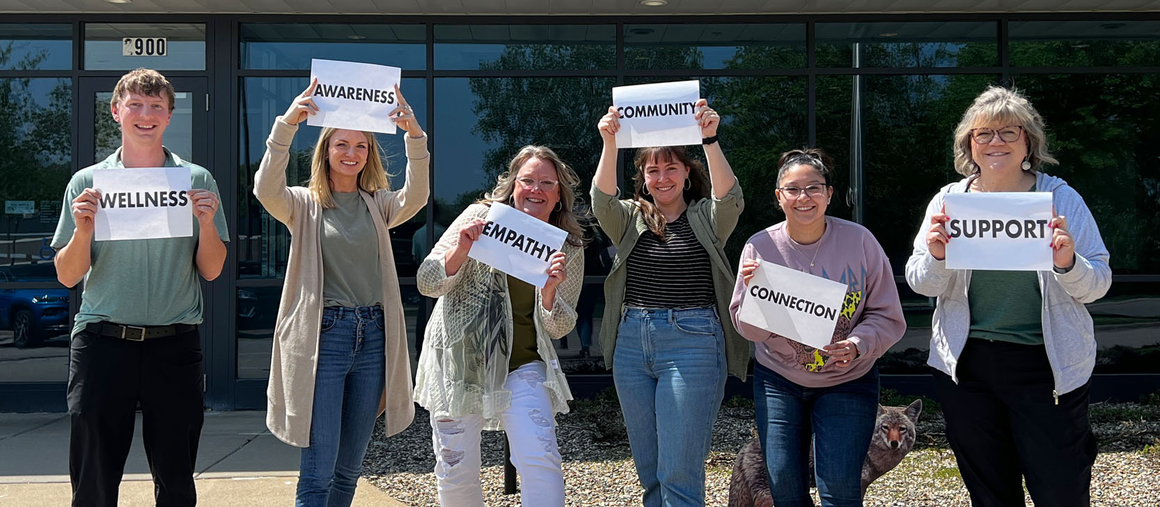 Employees holding signs