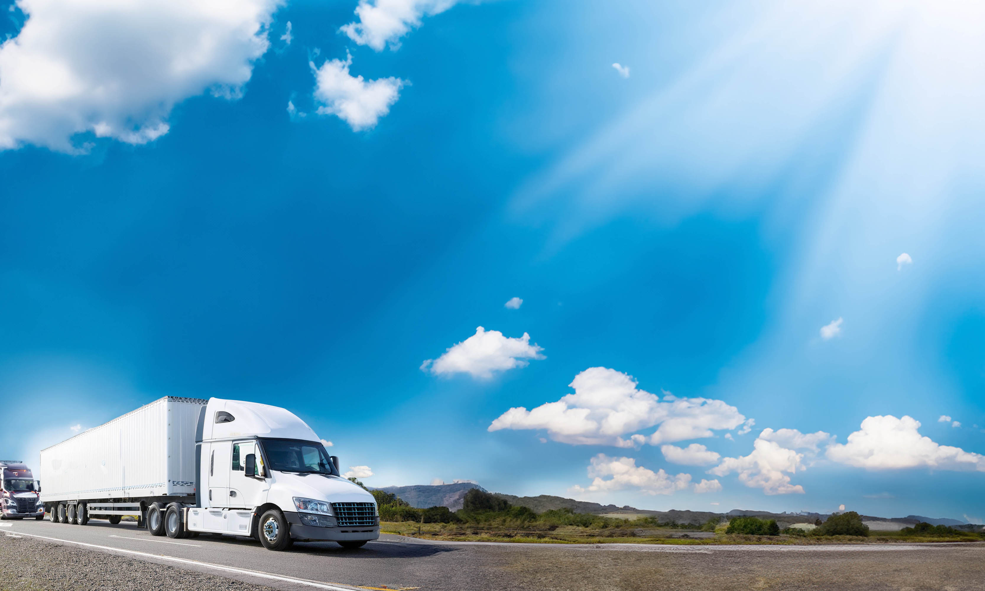 Truck driving in sunshine